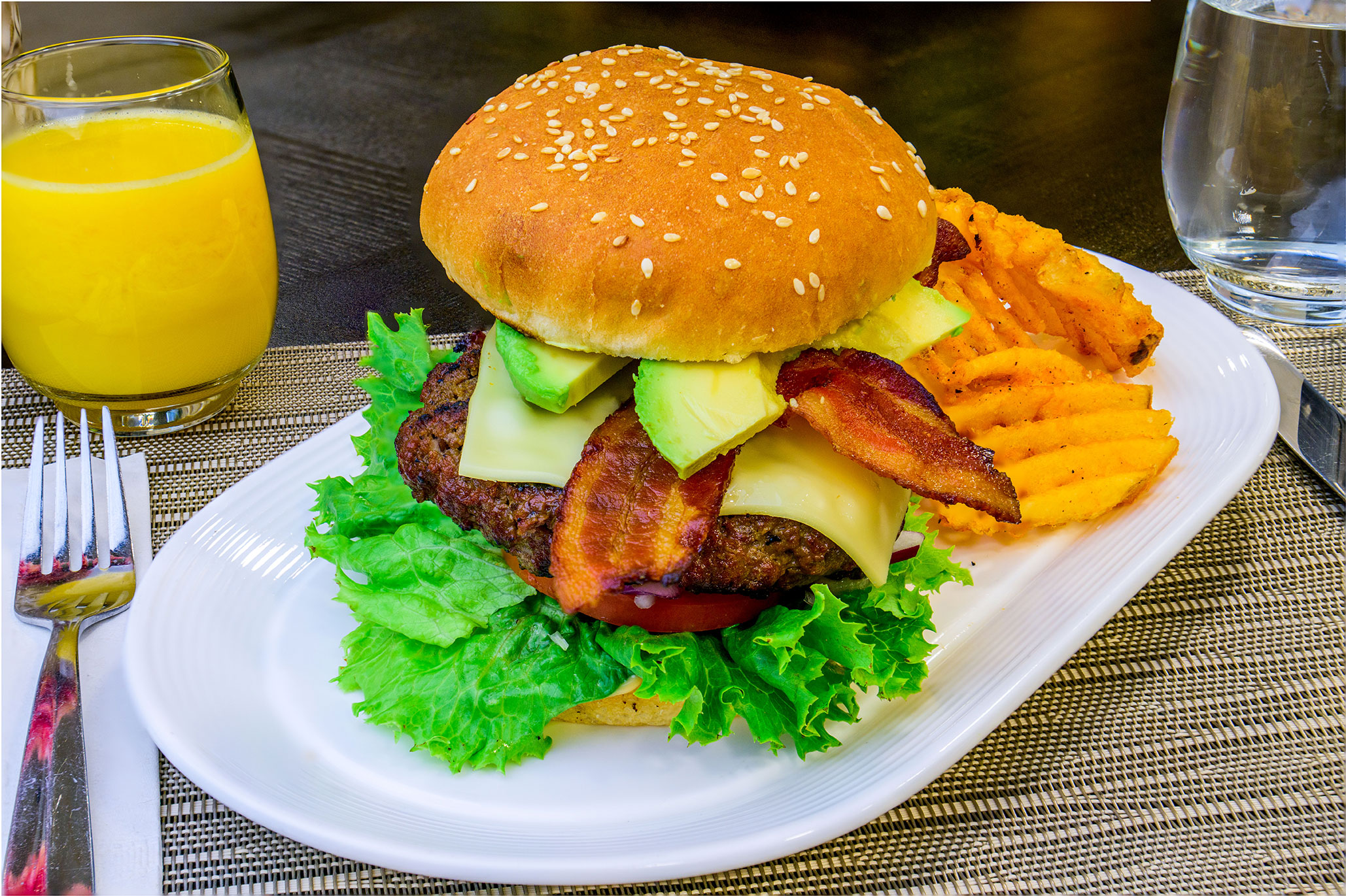 Bacon avocado cheeseburger, fries Elevate Dining